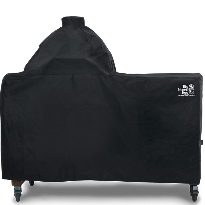 Big Green Egg afdekhoes voor Large in een acaciahouten tafel
